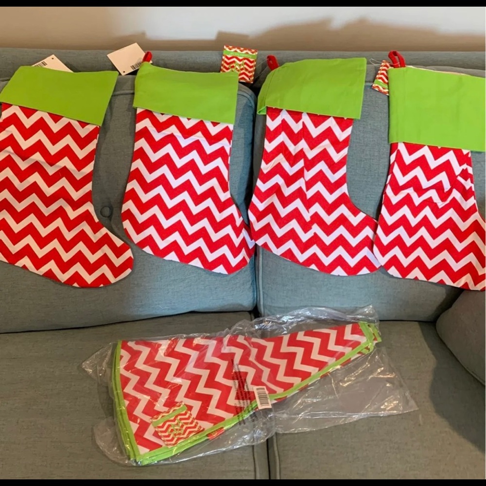 4 stockings and 1 tree skirt